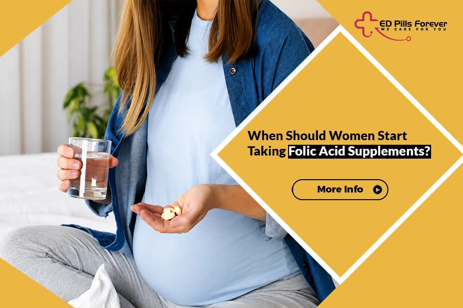 Pregnant woman holding folic acid supplements and a glass of water for healthy pregnancy planning